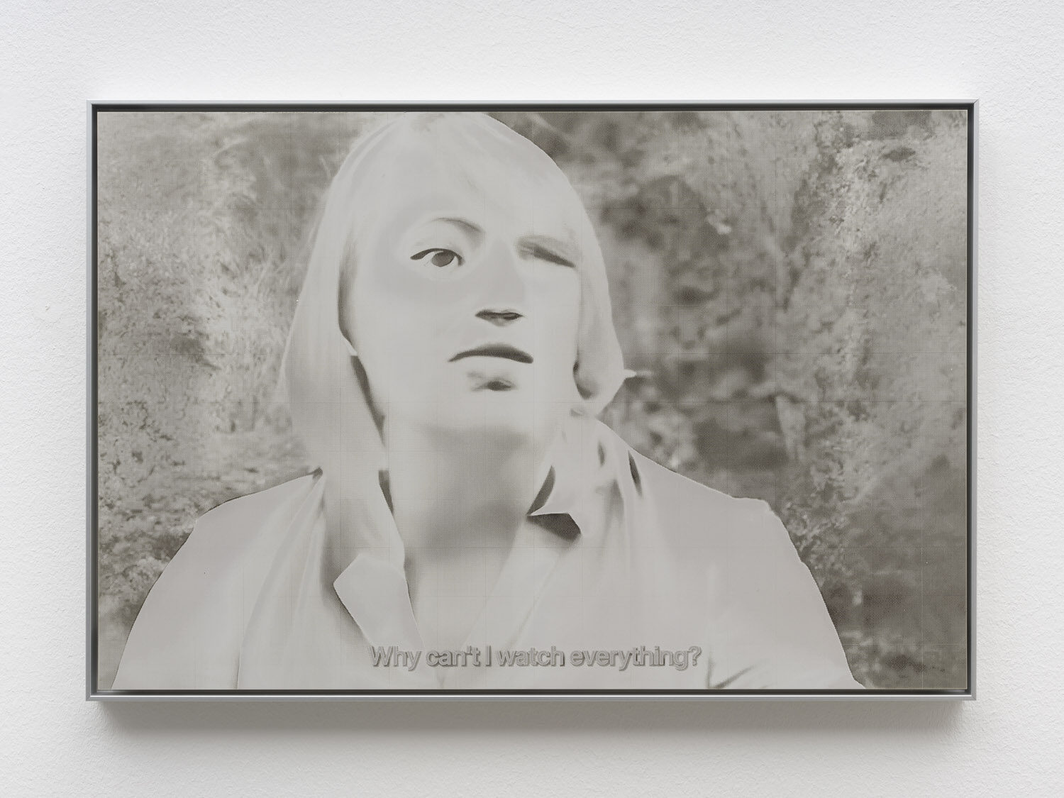 A pale laser-cut aluminium panel: a blonde figure turning to camera, subtitled “Why can't I watch everything?”