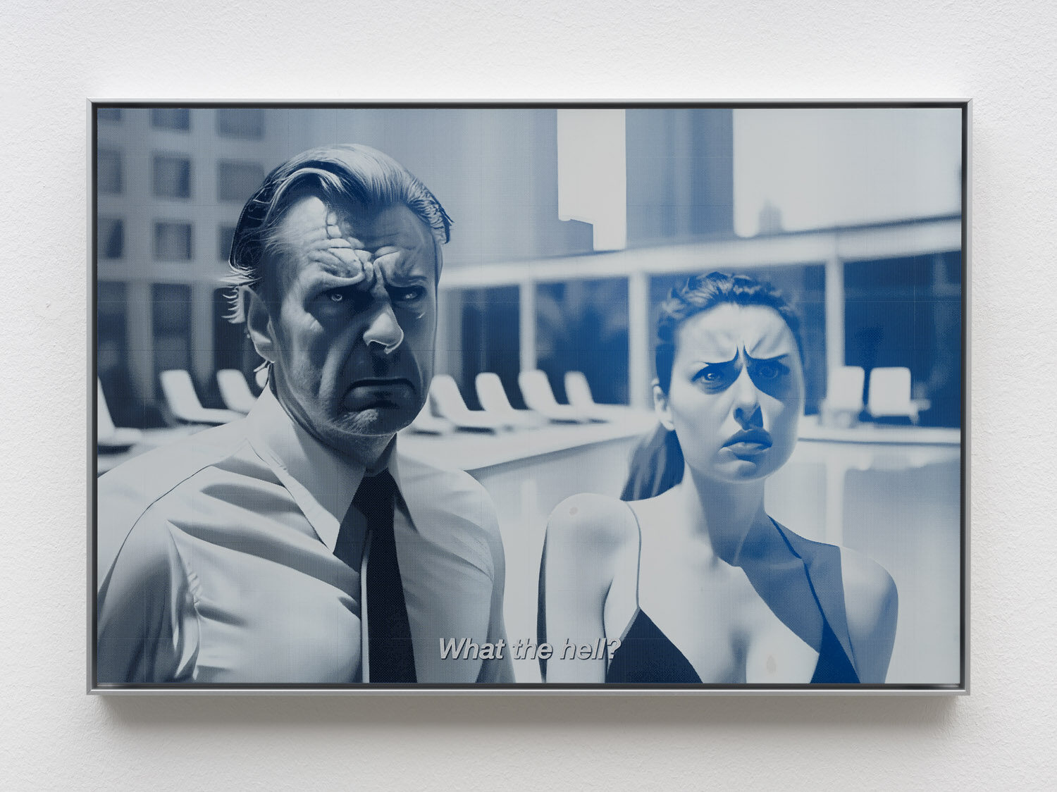 A blue-toned laser-cut aluminium panel: a frowning man in a tie beside a woman, subtitled “What the hell?”