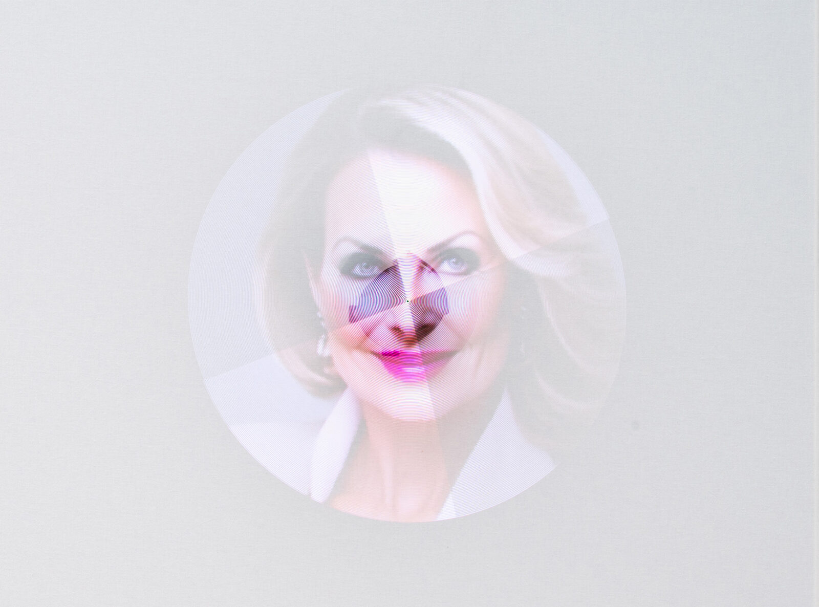 A portrait of a woman rendered as a spinning disc of fine concentric lines, her features resolving only near the centre.
