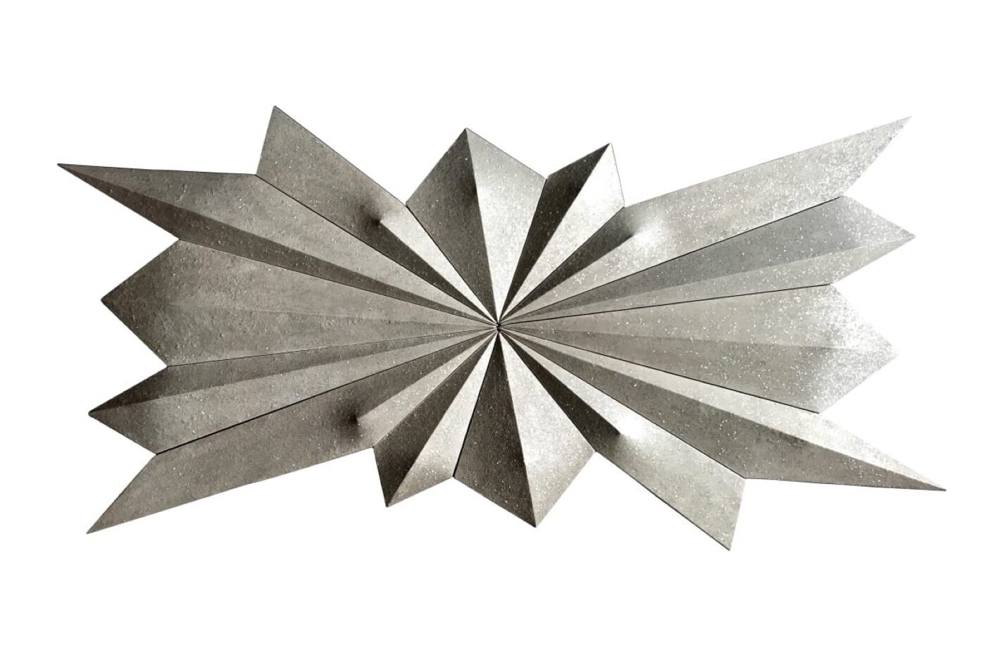A hand-built relief of faceted metallic-grey triangular panels radiating from a central point.