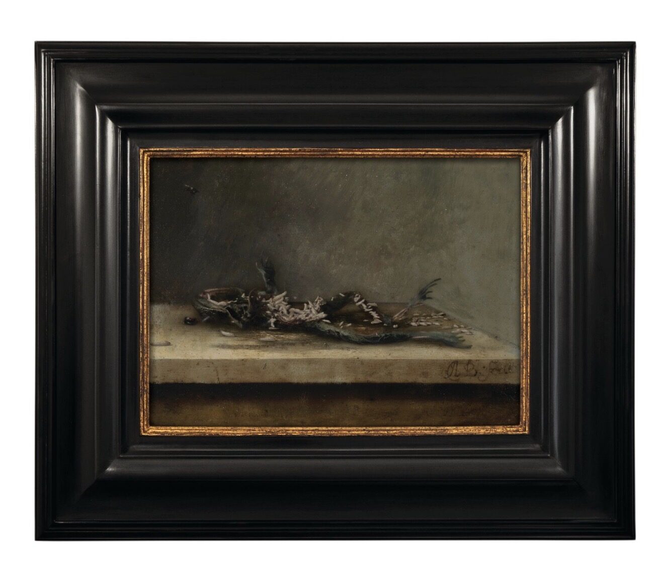 The same still life later in its cycle — the frog reduced to bones scattered across the ledge.